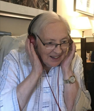 2019. Vera Hurren listens to one of Tony Hurren’s recordings from the 1960s.